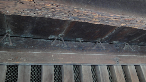 the wooden flooring itself with the metal clamps showing